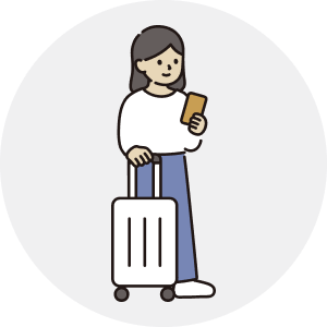 スーツケースを持つ女性